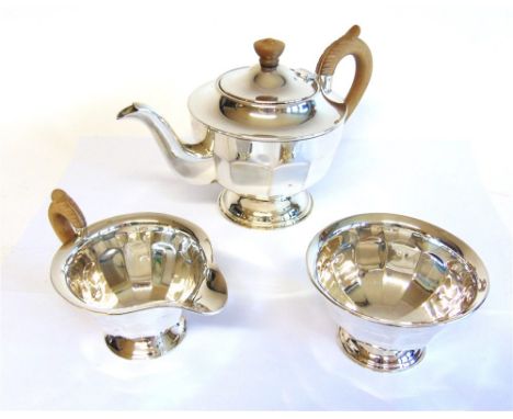 A SILVER THREE PIECE TEA SERVICE by Edward Viner, Sheffield 1960, of round panelled form, 696g (22.45 troy ozs) gross