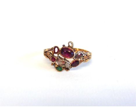 A VICTORIAN RUBY, DIAMOND AND EMERALD RING between split and carved shoulders, finger size K, 3.2g gross