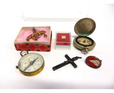 A POCKET COMPASS with another; a brooch; a crucifix; a tie tack; and a Climbing Club badge