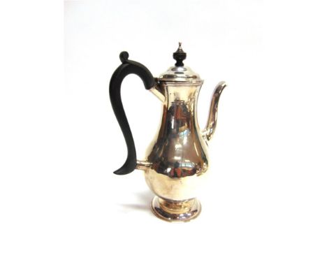A LATE VICTORIAN SILVER COFFEE POT by Edward Hutton, London 1882, in the plain baluster Georgian style, 25cm high, 482g (15.5