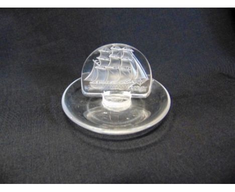 A LALIQUE GLASS PIN/RING DISH,  the centre decorated with a galleon, acid etched 'R LALIQUE FRANCE' to base, 10cm diameter