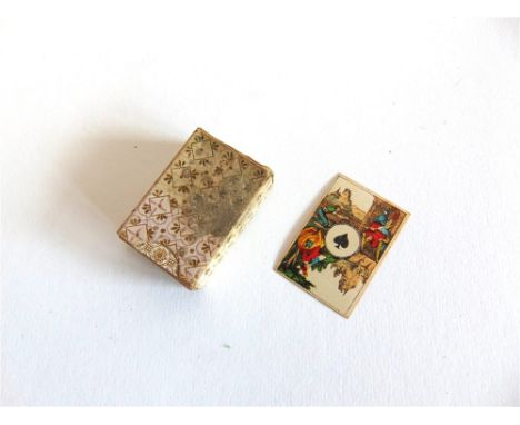 A MINIATURE PACK OF PLAYING CARDSby C.L. Wust of Frankfurt, with square corners and plain pink backs, in a card sleeve case (