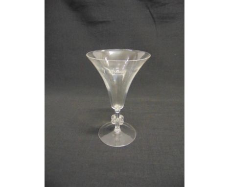 A LALIQUE COCKTAIL GLASS,  with trumpet shaped bowl on stem moulded with knot motif, the circular base acid etched 'R LALIQUE