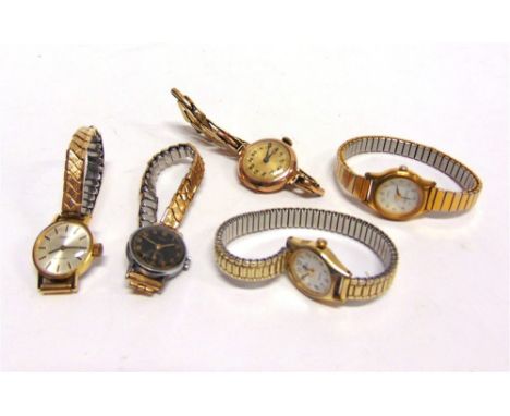 A LADY'S 9 CARAT GOLD WRIST WATCH on an expanding baton link bracelet; with four other lady's wrist watches including a Tisso