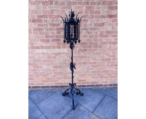 A WROUGHT IRON STANDARD LAMP  in the Moorish taste, 177cm high