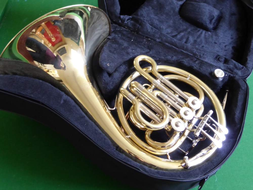 A Bass Silver and Lacquer French Horn, by J. Michael, in the original case.