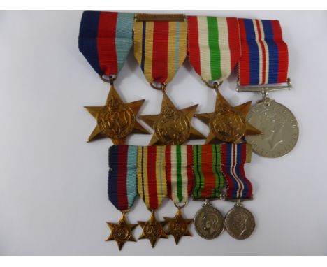 Group of Four Medals, 1939-45 Star, Africa Star, with first army bar, Defence Medal Italian Star together with miniatures inc