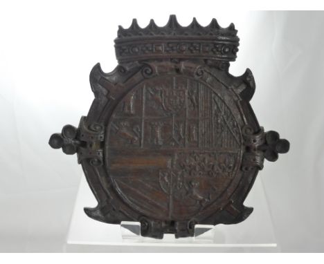 A Wooden Antique Armorial depicting carved Coat of Arms with a crown atop, inscribed on reverse "A bit of carving my parents 