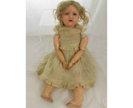 A Heinrich Handwerck Porcelain Headed Doll, stamped H W Germany 6.1/2, the doll with sleeping eyes, with segmented limbs.