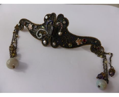 An Antique Continental Silver Filigree and Enamel Semi-Precious Stone Cloak Clasp, the wing form clasp having floral enamel d