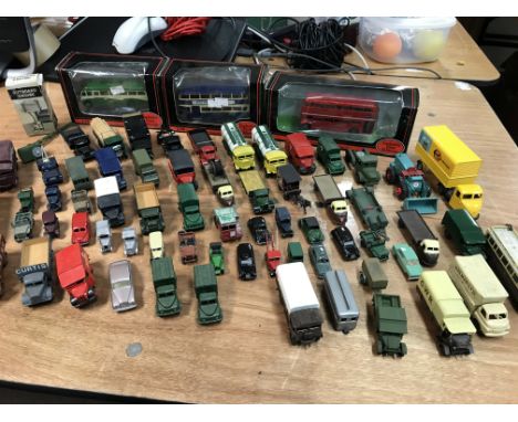 A collection of diecast and plastic unboxed vehicles, many OO scale.