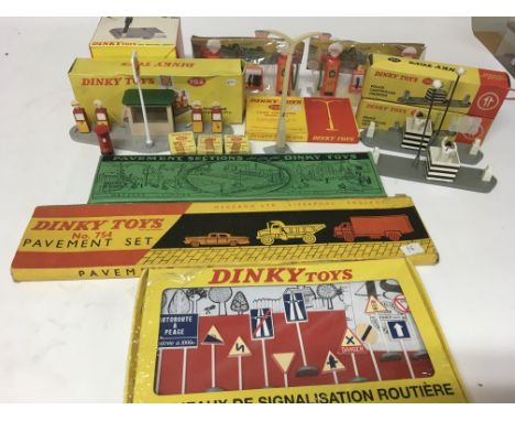 Dinky toys, a collection of boxed roadside accessories including #593 Roadsigns, #754 Pavement set, #46 Pavement sections, #7