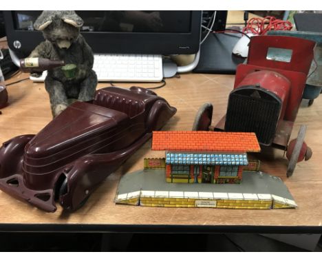 A collection of vintage toys including a beer drinking automaton bear, A Bakelite vintage car with damage, Triang tinplate ti