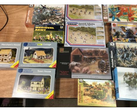 A box containing a collection of 1:72 scale military figures, farm animals, buildings etc