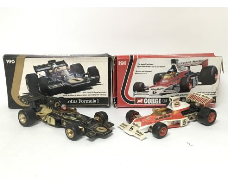 Corgi toys , boxed F1 racing cars , 1:18 scale , including #190 JPS Lotus and #191 Texaco Marlbro McLaren M23, 1973