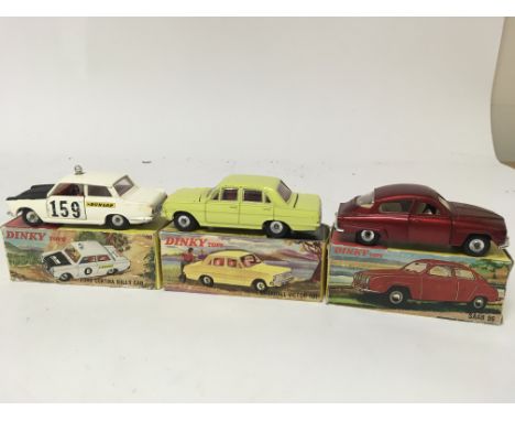 Dinky toys, #212 Ford Cortina rally car, #156 SAAB 96 and #151 Vauxhall Victor 101, boxed