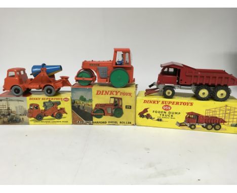 Dinky toys, #960 Lorry mounted concrete mixer, #279 Ayeling-Barford diesel roller and #959 Foden dump truck (damaged), boxed