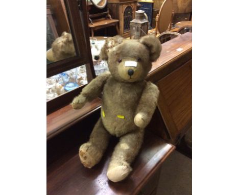 A vintage straw filled Teddy bear