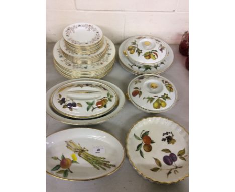 A quantity of Royal Worcester 'Evesham' patterned china; a quantity of Minton 'Spring Melody dinner and side plates