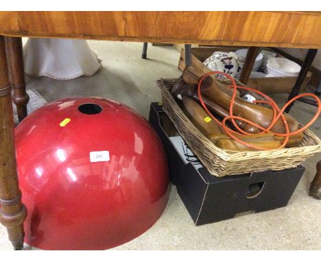 A red metal light shade; a basket containing shoe lasts; a wooden table lamp; and one other box of metal and wooden ware
