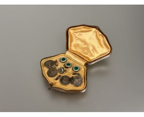 A set of four miniature silver studs with emerald green enamel center panels with white border - one a/f: d. x 1cm and a set 