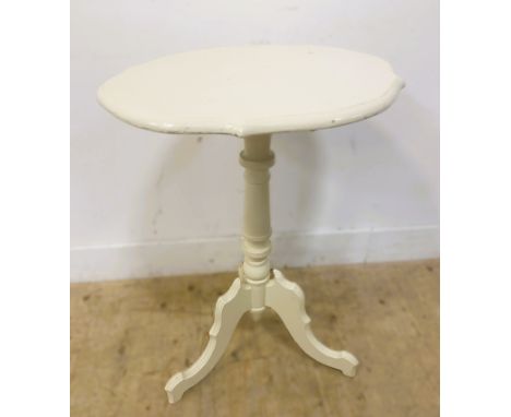 White painted occasional table, with a shaped top on a turned column and tripod base, 73.5cm x 52cm x 45cm 303
