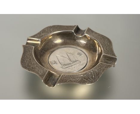 A Chinese sterling silver Lee Yee Hing Chinese export silver ashtray with inset coin and alternating bamboo and dragon panel 