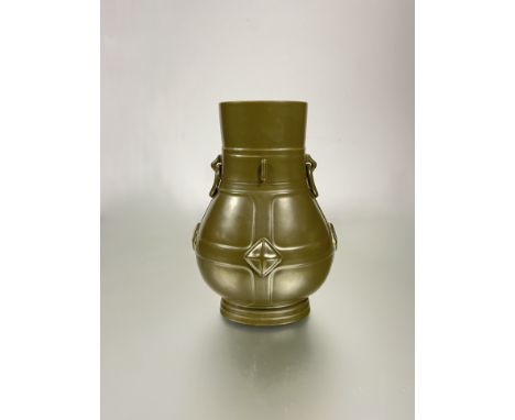 A Chinese teadust-glazed vase, probably 20th century, of oval form with moulded ring handles and impressed mark of Qianlong t