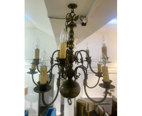 A Flemish brass chandelier, with ten shaped arms on two tiers around a bulbous body with a double bird finial, 90cm x 60cm 