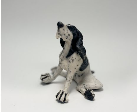 Y Christine Cummings (British, b. 1969), Seated Dog, a raku pottery model, incised monogram and dated 2006. Height 23cm. Note