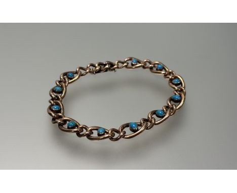 A 9ct gold and turquoise bracelet, the openwork chain collet-set with turquoise points, stamped "9". Length 19.5cm, 10g.