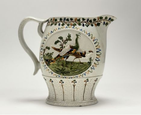 A large Prattware jug, c. 1800, of ovoid form, with moulded polychrome decoration centred to each side by an oval cartouche e