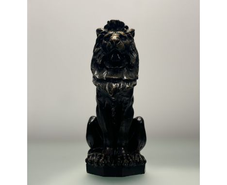 Scottish School, 20th century, a patinated bronze model of a lion, seated on it's haunches, unsigned. Height 35cm. Provenance