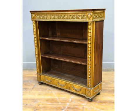 A neat 19thc mahogany topped and boxwood strung giltwood carved bookcase, fitted three shelves, flanked by ball pattern colum