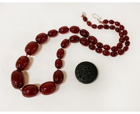 CHERRY BEADED NECKLACE STYLE WITH A POSSIBLY BLACK JADE BEAD