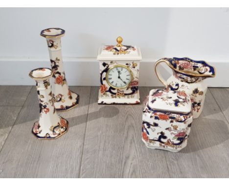 5 pieces of Mason ironstone wear in blue Mandalay pattern including water jug mantle clock and candle stick holders etc . No 