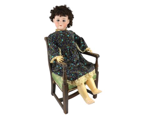 A Heinrich Handwerck bisque doll, German, circa 1900, impressed HANDWERK 16 99 DEP 7, with open mouth and upper teeth, weight