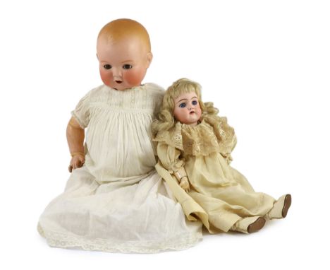 A Heinrich Handwerck bisque doll, German, circa 1900, impressed 79 10, with open mouth and upper teeth, weighted blue glass e