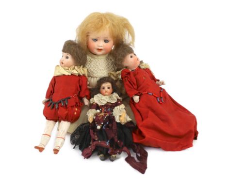 A pair of Recknagel bisque headed dolls, German, circa 1900, one impressed R 16/0 A, both with open mouth and upper teeth, fi