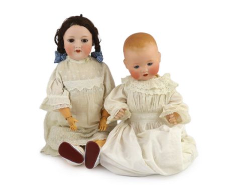 Two Armand Marseille bisque dolls, the first impressed 390n A. 6½ M. with weighted brown glass eyes, open mouth and upper tee