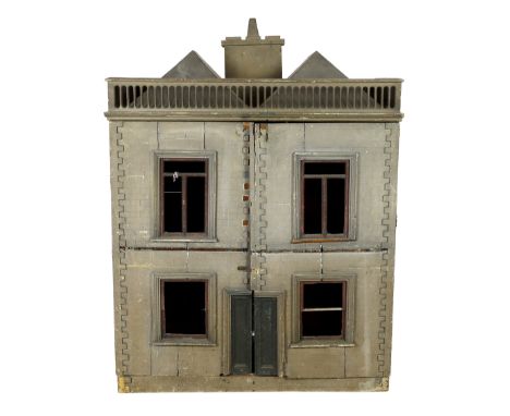 A very large English dolls’ house, circa 1840-1850, with a central panelled door and large windows to either side, heavy rust