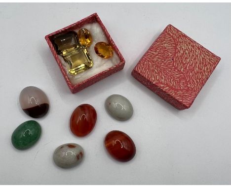 

A selection of loose gemstones including three citrines, a smoky quartz (all faceted) plus six cabochon stones. Sold in sup