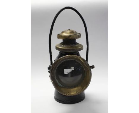 An early 20th century Lucas King of The Road Automobile lamp, black with bras fittings, label to back, approx&nbsp;40cm high 