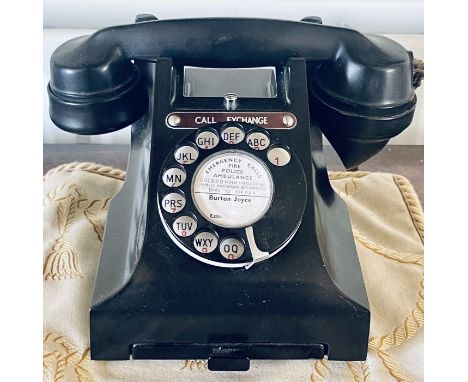 A Bakelite ebonised telephone with a pullout tray.&nbsp;

***Offsite location***

