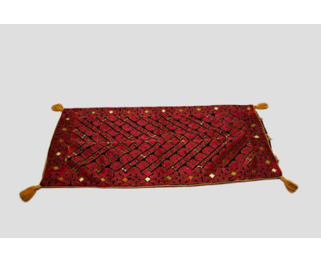 Four Indian silk embroidered cushion covers, probably north India, mid-20th century, two 32in. 81cm. Square, the first embroi