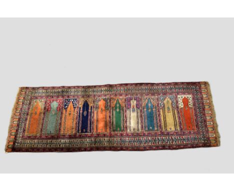 Two rugs, the first: Kayserie 'art silk' saf, north central Anatolia, circa 1930s, 7ft. 8in. X 2ft. 11in. 2.34m. X 0.89m. Ove