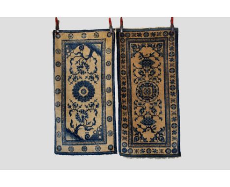 Two Baotou-Suiyuan pictorial rugs, north west China, early 20th century, the first, with peony blossom and central medallion 