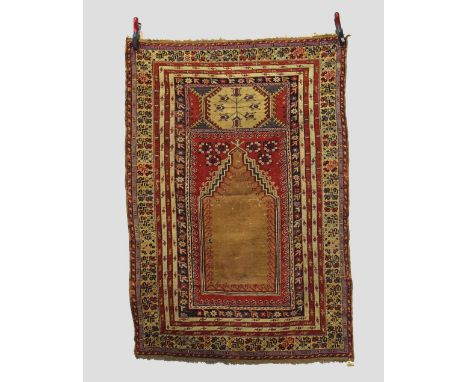 Mucur prayer rug, central Anatolia, first half 19th century, 5ft. 6in. X 3ft. 10in. 1.68m. X 1.17m. Overall even wear; corros