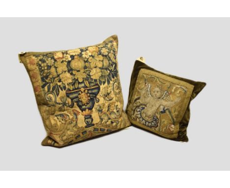 Two tapestry cushions, the first made up of Flemish tapestry, 16th century, 18in. 46cm. Square depicting a central urn of flo