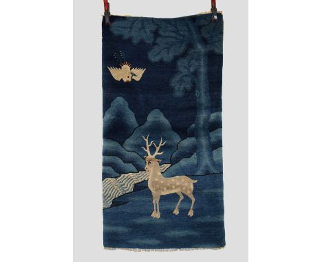 Baotou-Suiyuan pictorial rug, north west China, first half 20th century, 4ft. 9in. X 2ft. 6in. 1.45m. X 0.76m.  Dark to mid-b